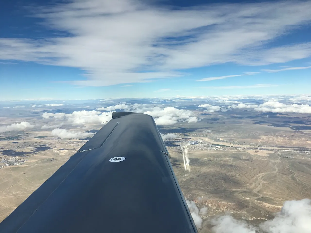 On approach to Las Vegas - desert landscape with scattered clouds